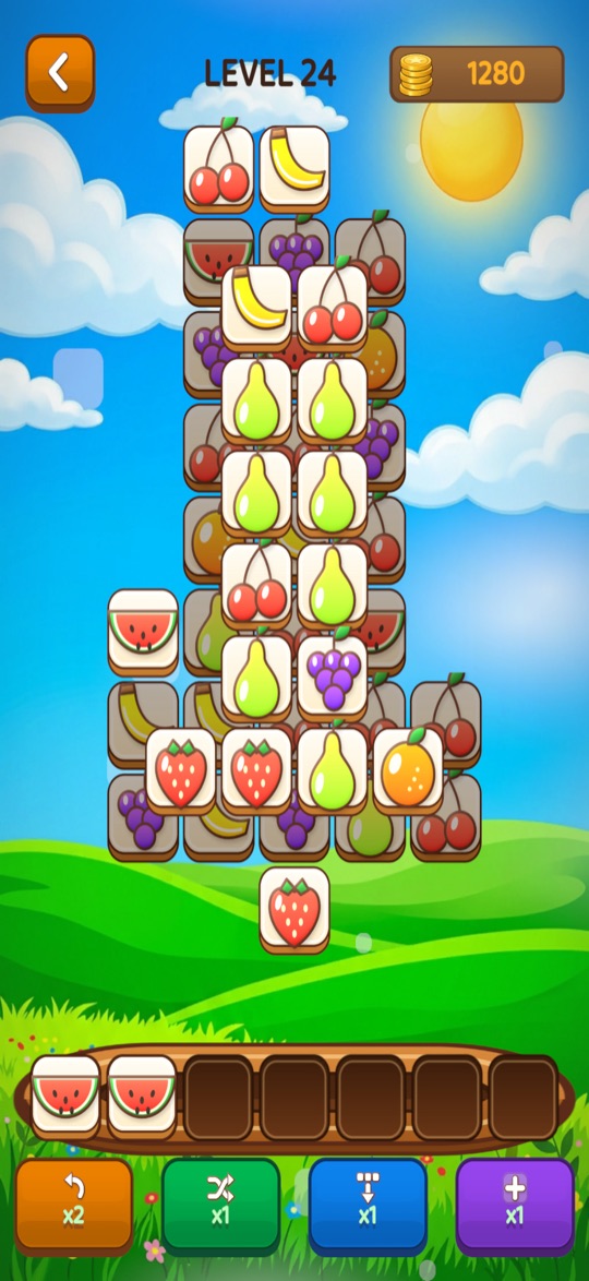 A pile of fruit tiles with two matching watermelons in the tray